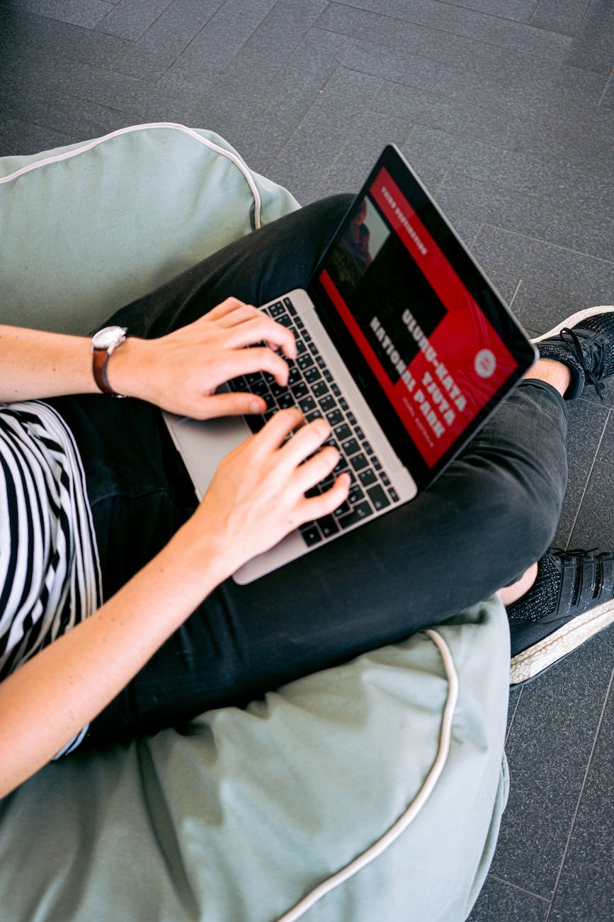 man creating a presentation on laptop